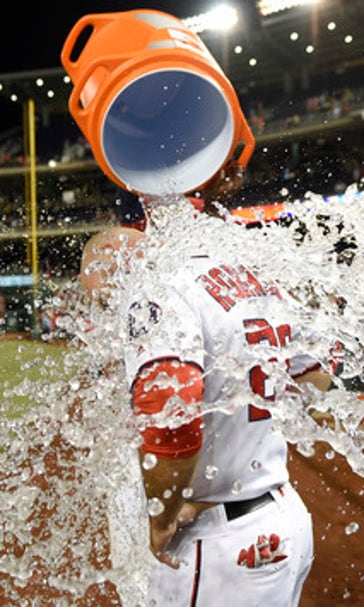 After Harper gets ejected, Robinson lifts Nats past Tigers